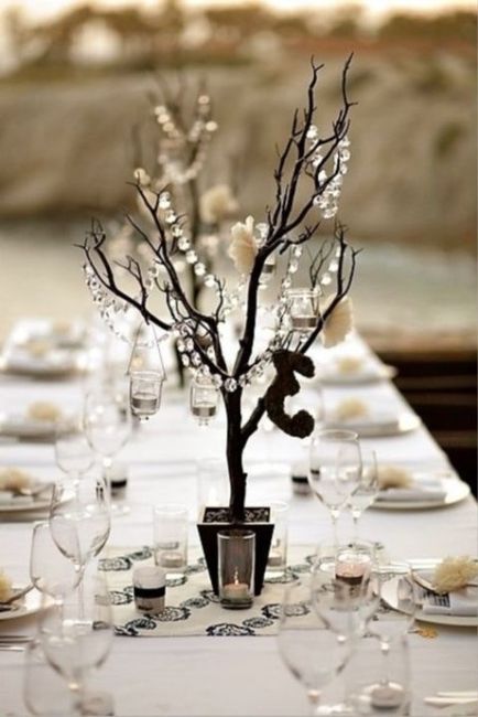 5. Centro de mesa con un ramo de madera y cristales